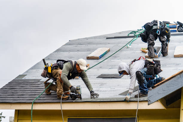 Professional Storm Damage Roof Repair technician working in Manhasset, NY